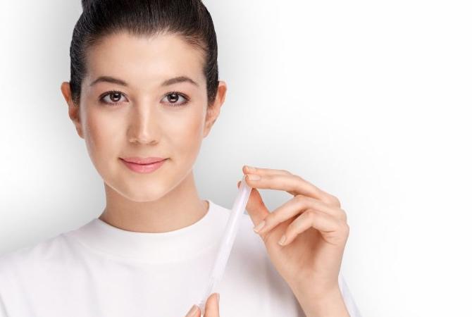 Woman holding medical applicator